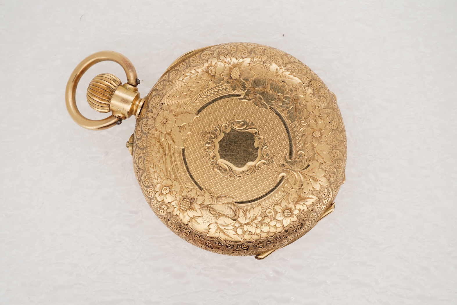 A lady's early 20th century Swiss engraved 18k open faced keyless fob watch